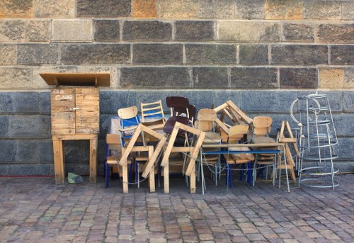 People arranging furniture during clearance in Penge